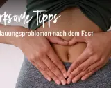 Hände formen ein Herz über dem Bauch, um die Verdauung anzuregen. 7 Tipps bei Verdauungsproblemen nach dem Fest. #BEATYESTERDAY.