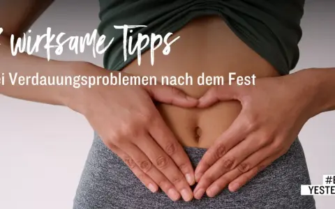 Hände formen ein Herz über dem Bauch, um die Verdauung anzuregen. 7 Tipps bei Verdauungsproblemen nach dem Fest. #BEATYESTERDAY.